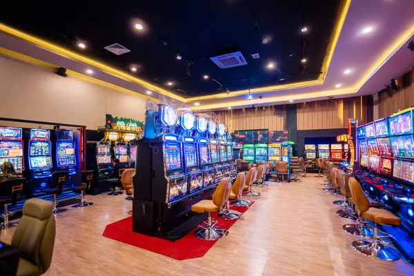 A glamorous woman holding casino chips in a neon-lit environment, representing the premium online casino atmosphere of JDLOVE.