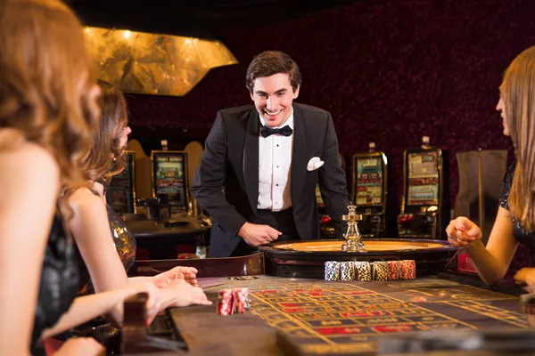 A stylish woman beside vibrant slot machines displaying glowing sevens, showcasing the variety of top slots at JDLOVE.