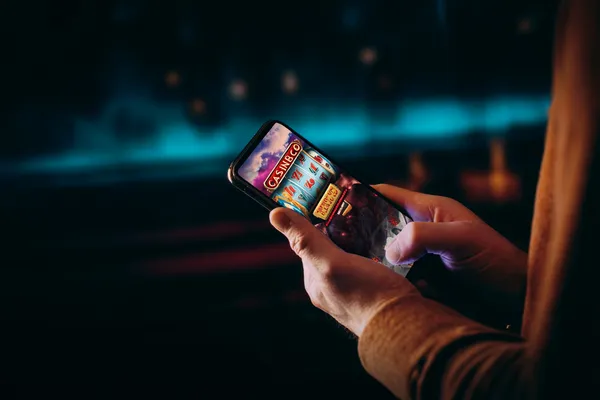 A close-up shot of golden coins falling around a spinning roulette wheel, representing immersive casino action at JDLOVE.
